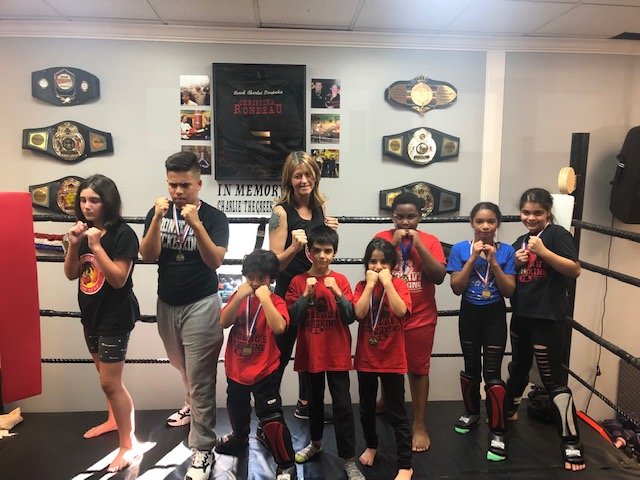 LITTLE KICKERS: Pictured from left to right are Natalea Cotugno, Kyle Silveira, Jose Miguel Restreppo, Coach Becky Rhodes, Ibbi Hagen, Izza Hagen, Keenan Honore, Lexmarlen Garcia, Lexmarly Garcia. (Submitted photos)
